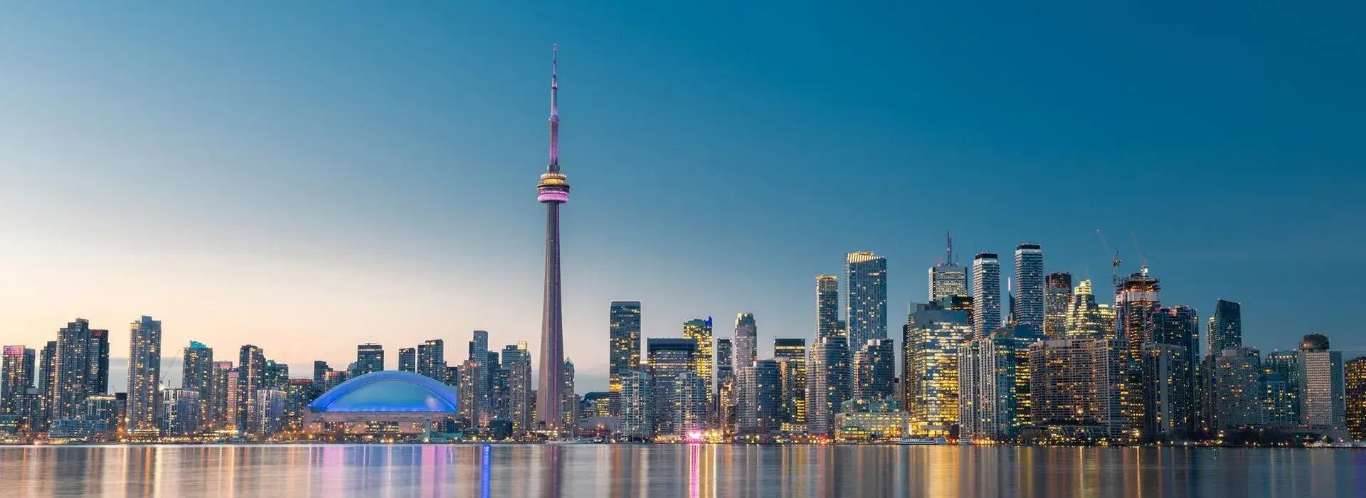 Toronto cityscape with a gradient blue sky